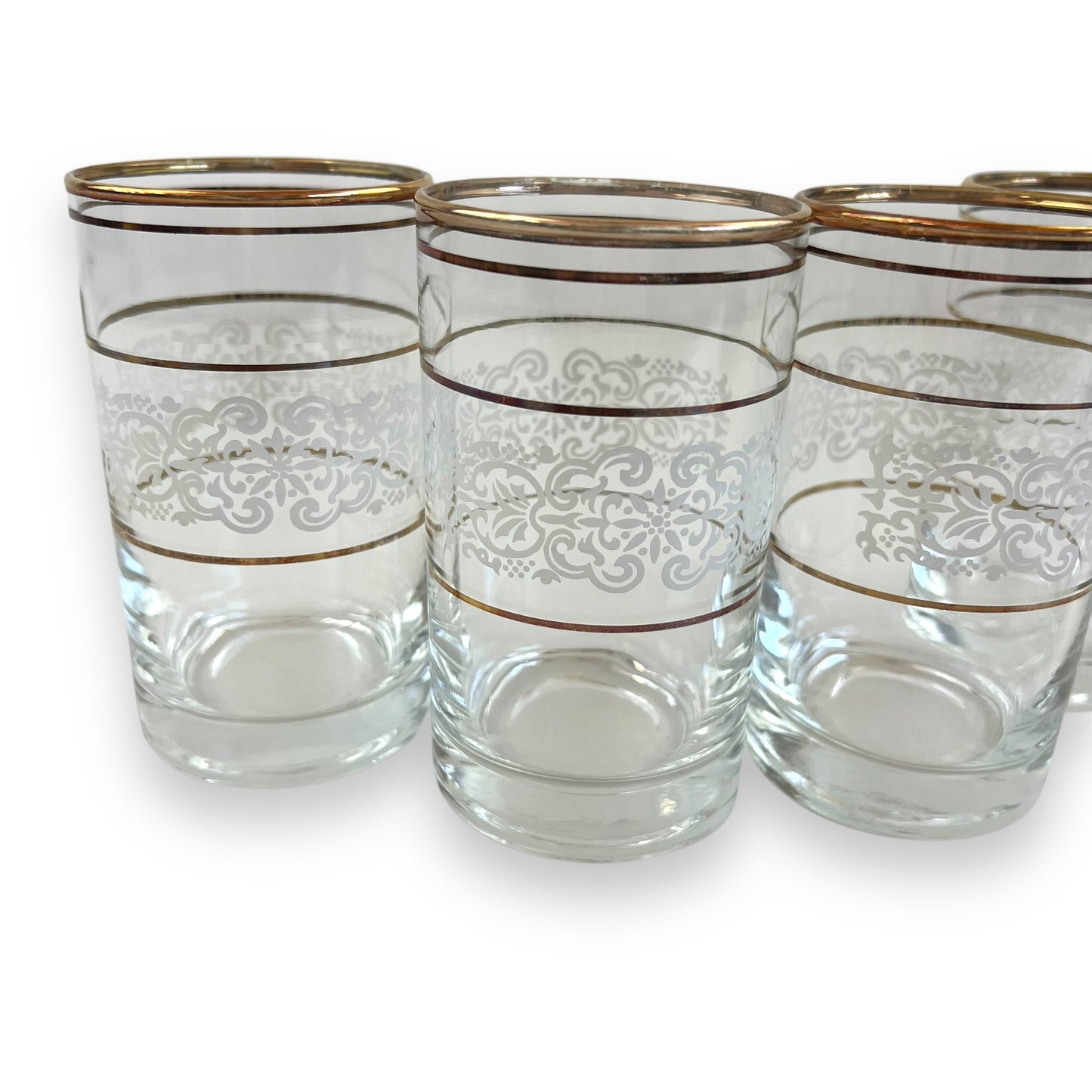 White ornate pattern with gold band glass set of 4