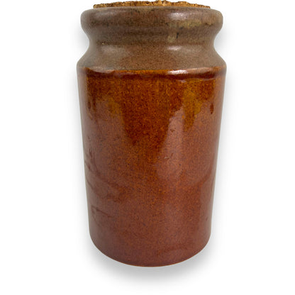 Brown pottery jar with cork lid