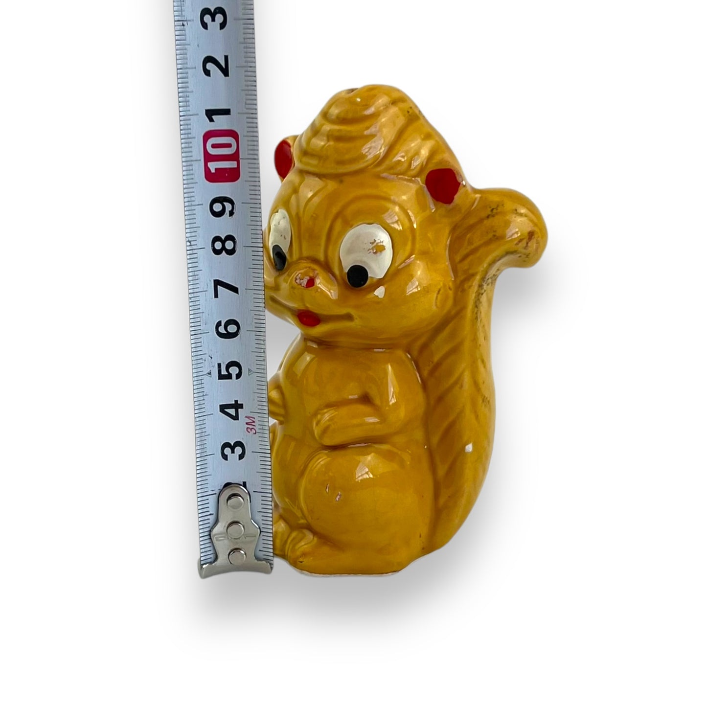 Retro yellow squirrel statue