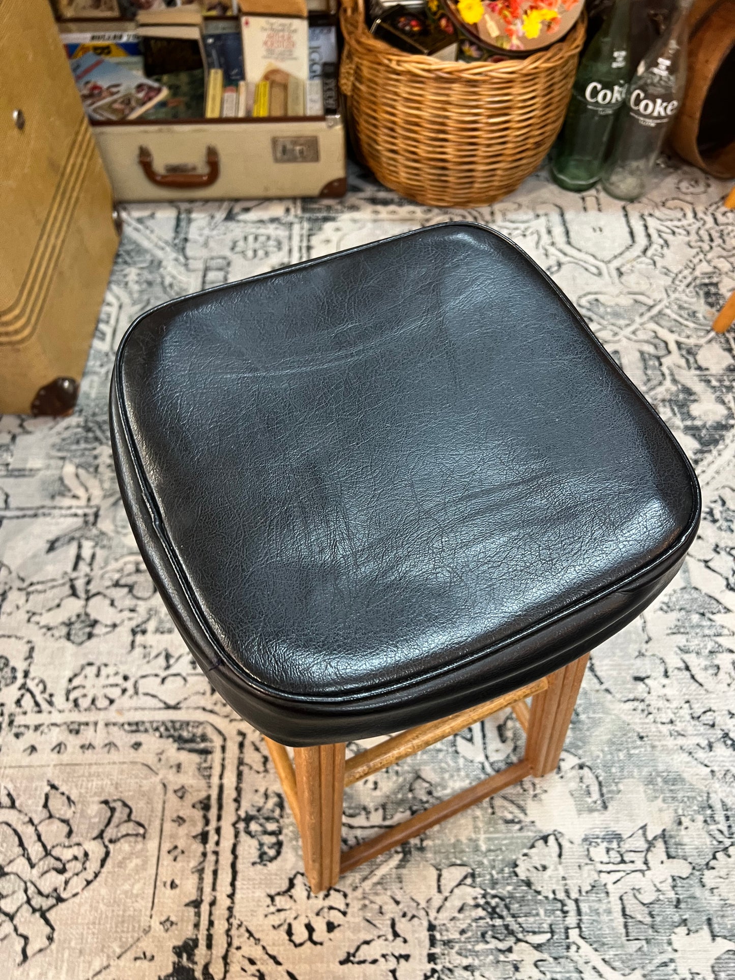 Wooden stool with black top