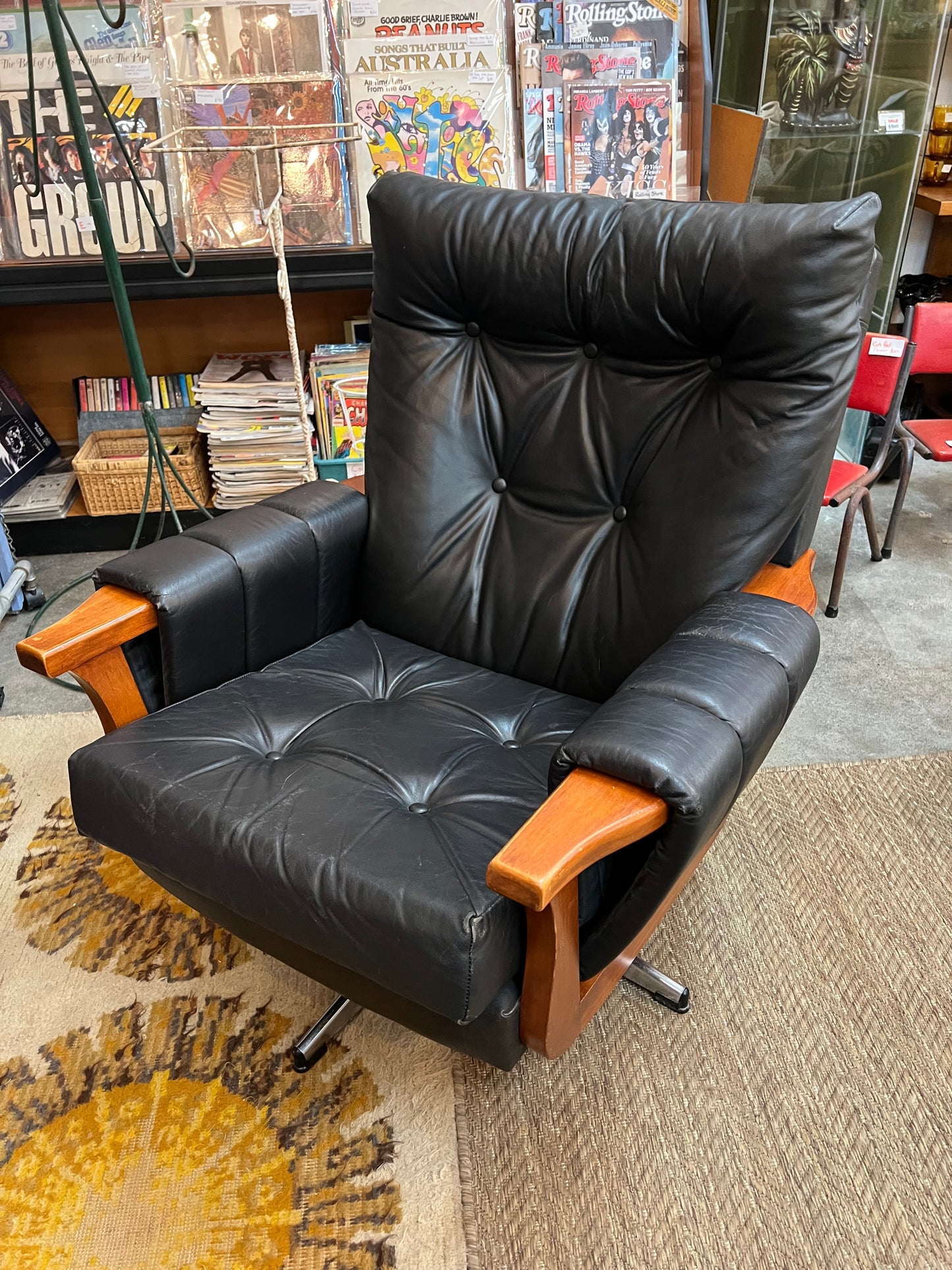 2. Mid-Century Black Leather Swivel Lounge Chair