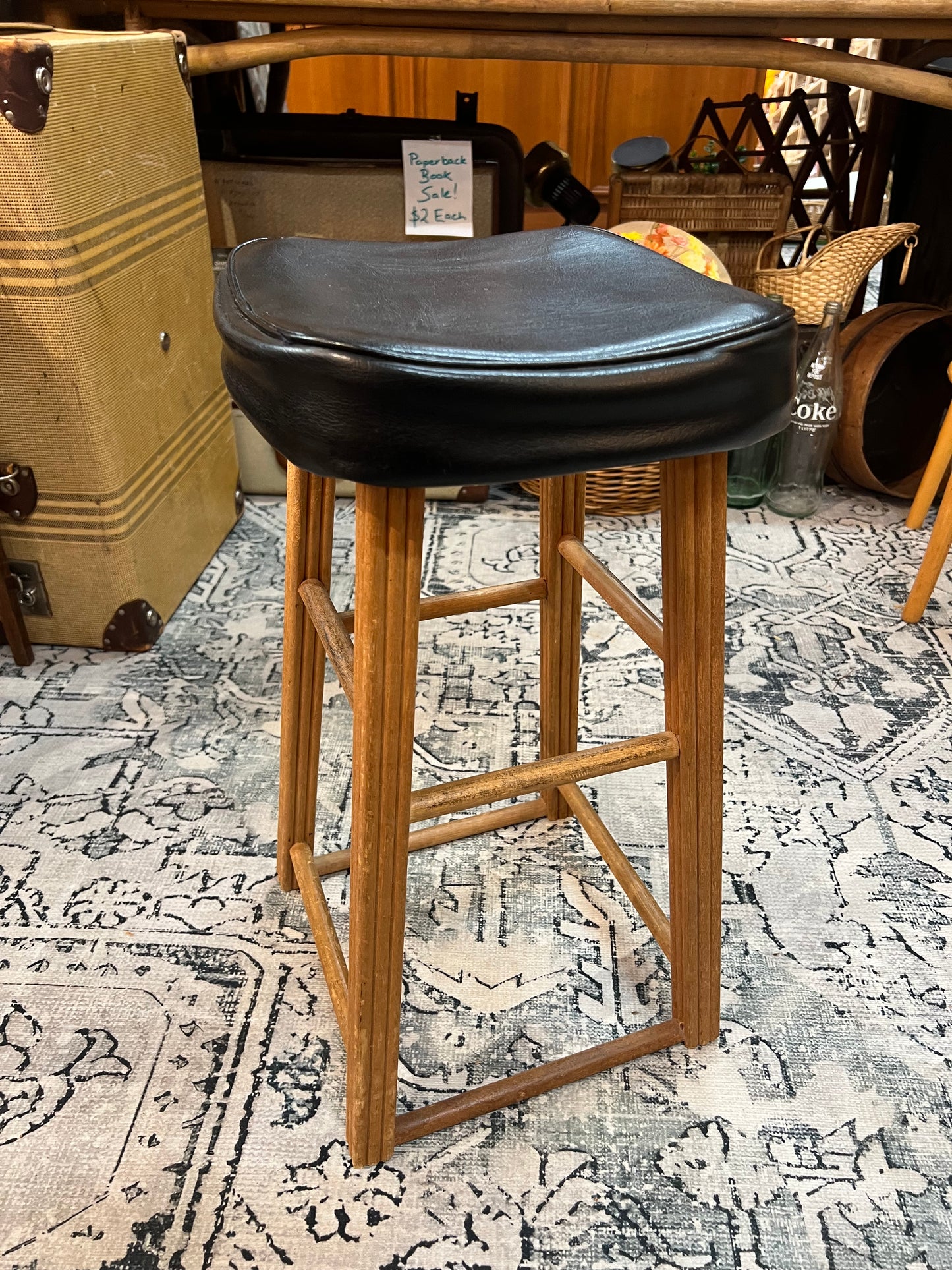 Wooden stool with black top