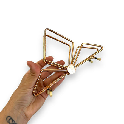 Copper coloured triangle design letter / napkin holder