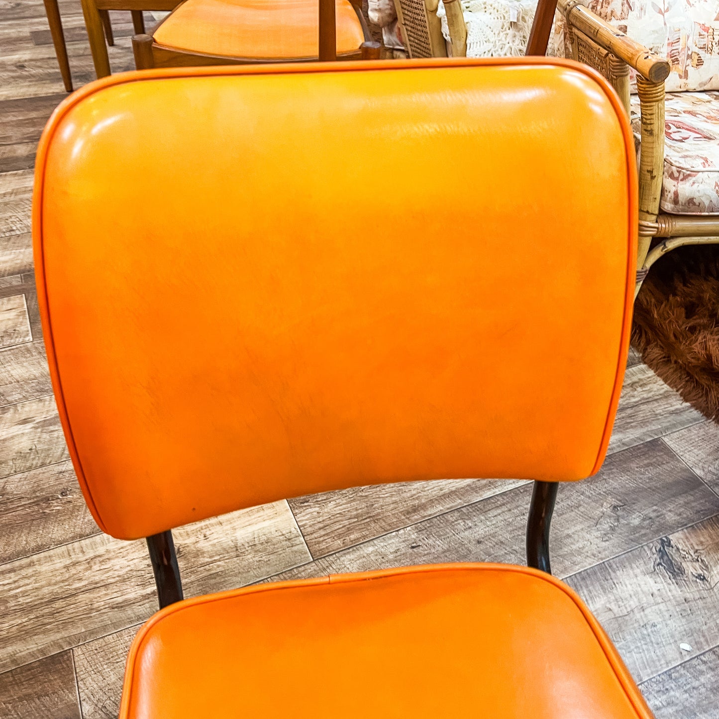 Pair of Vintage Swivel Chairs – Orange Vinyl & Black Star Base