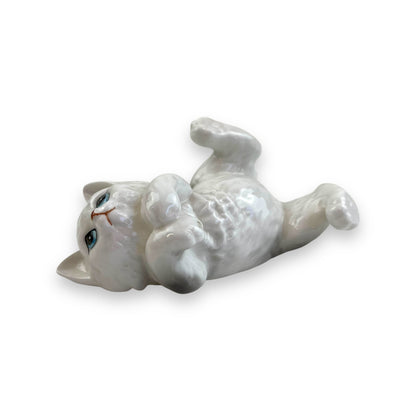 Cat laying on back ornament statue