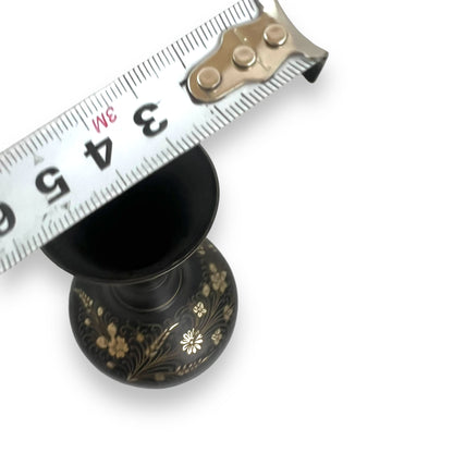 Black metal vase with gold etched flower design