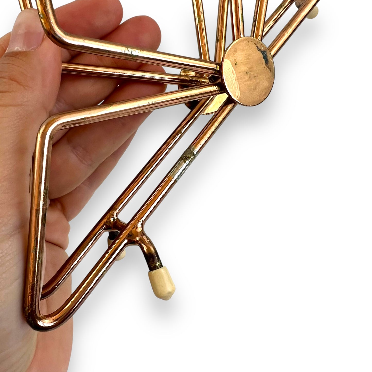 Copper coloured triangle design letter / napkin holder