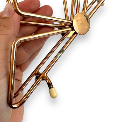 Copper coloured triangle design letter / napkin holder
