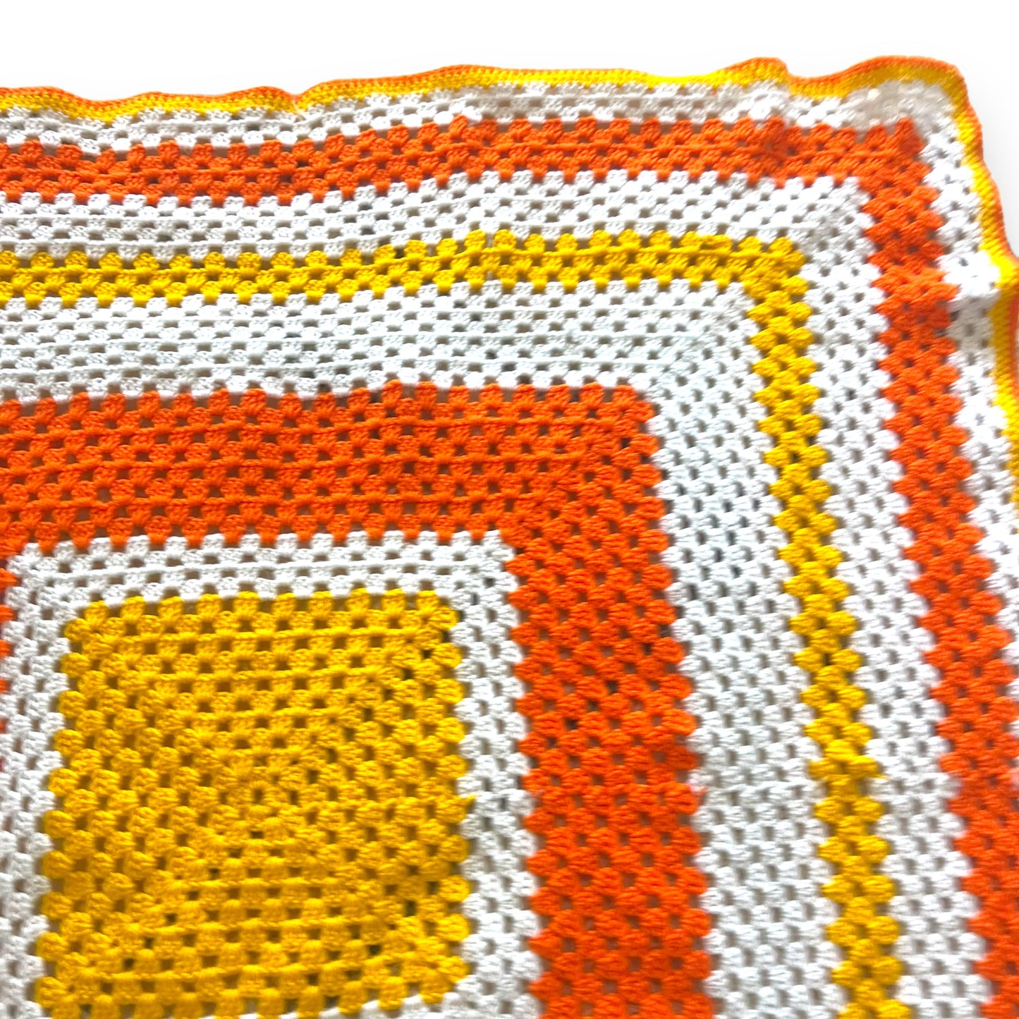 Orange, yellow and white crochet knit blanket
