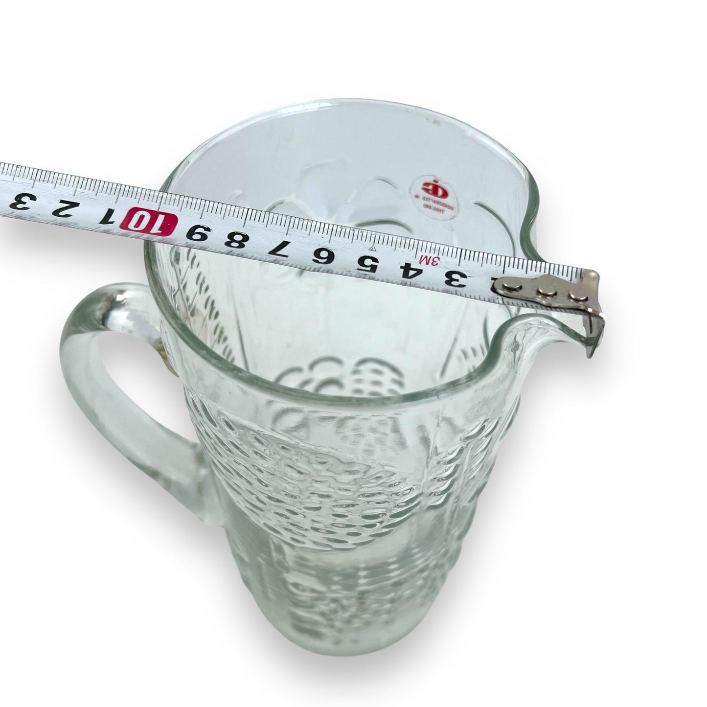 Pressed flower pattern clear glass pitcher