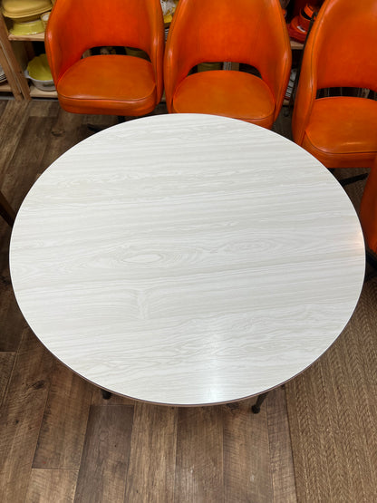 Namco Round Mid Century Dining Table with White Woodgrain Laminate Top and black steel legs