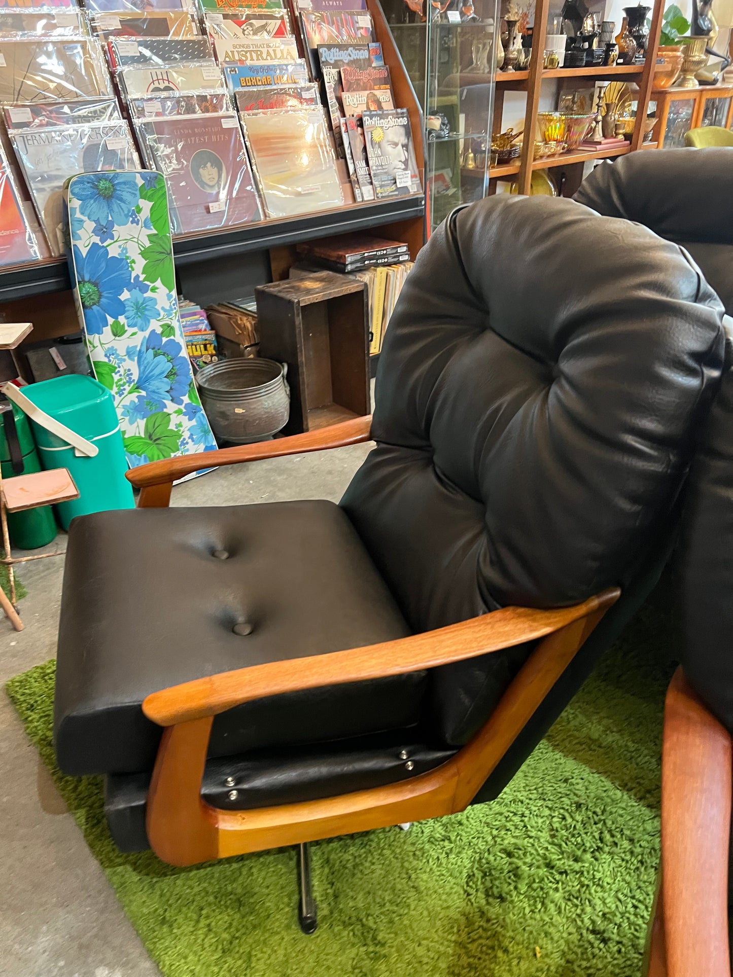 1. Black Vinyl Swivel Armchair with Timber Arms