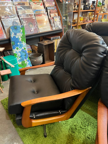 1. Black Vinyl Swivel Armchair with Timber Arms