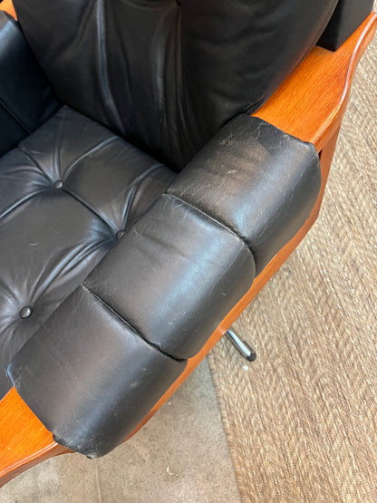 1. Mid-Century Black Leather Swivel Lounge Chair