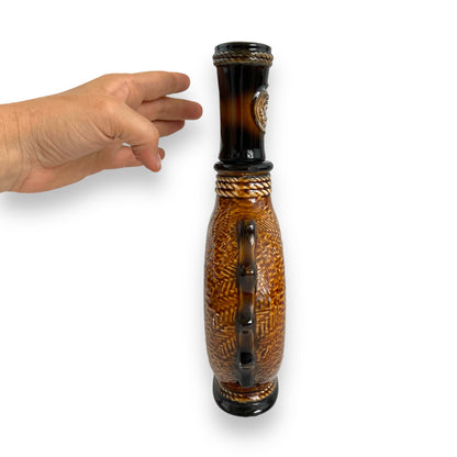Brown Ceramic Decanter with Ship and wheel design.