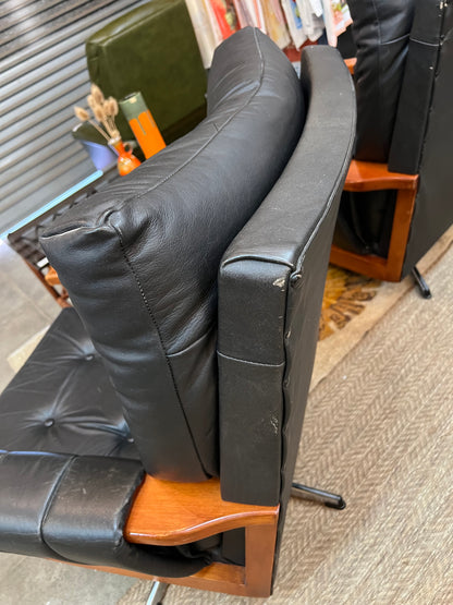 1. Mid-Century Black Leather Swivel Lounge Chair