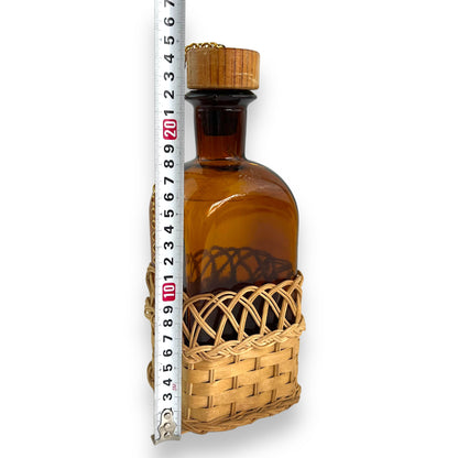 Amber glass decanter bottle with cane base and cork stopper