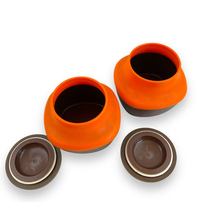 Orange and Brown Plastic Storage Canisters with suction wood look lids