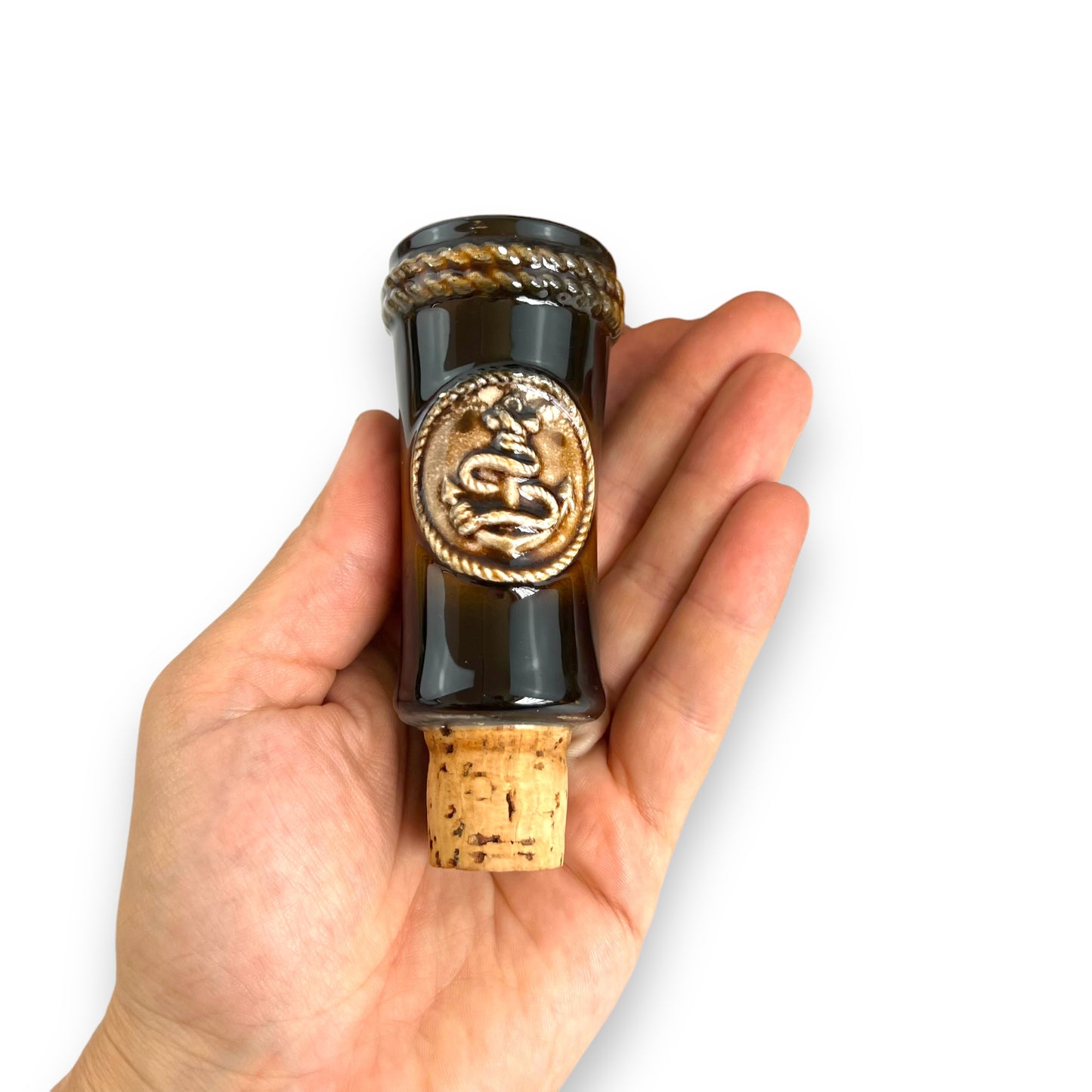 Brown Ceramic Decanter with Ship and wheel design.