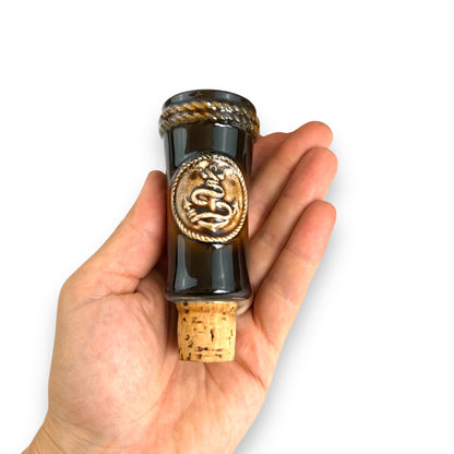 Brown Ceramic Decanter with Ship and wheel design.