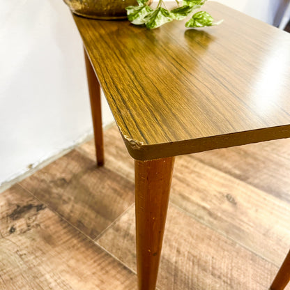 Small brown laminate side table