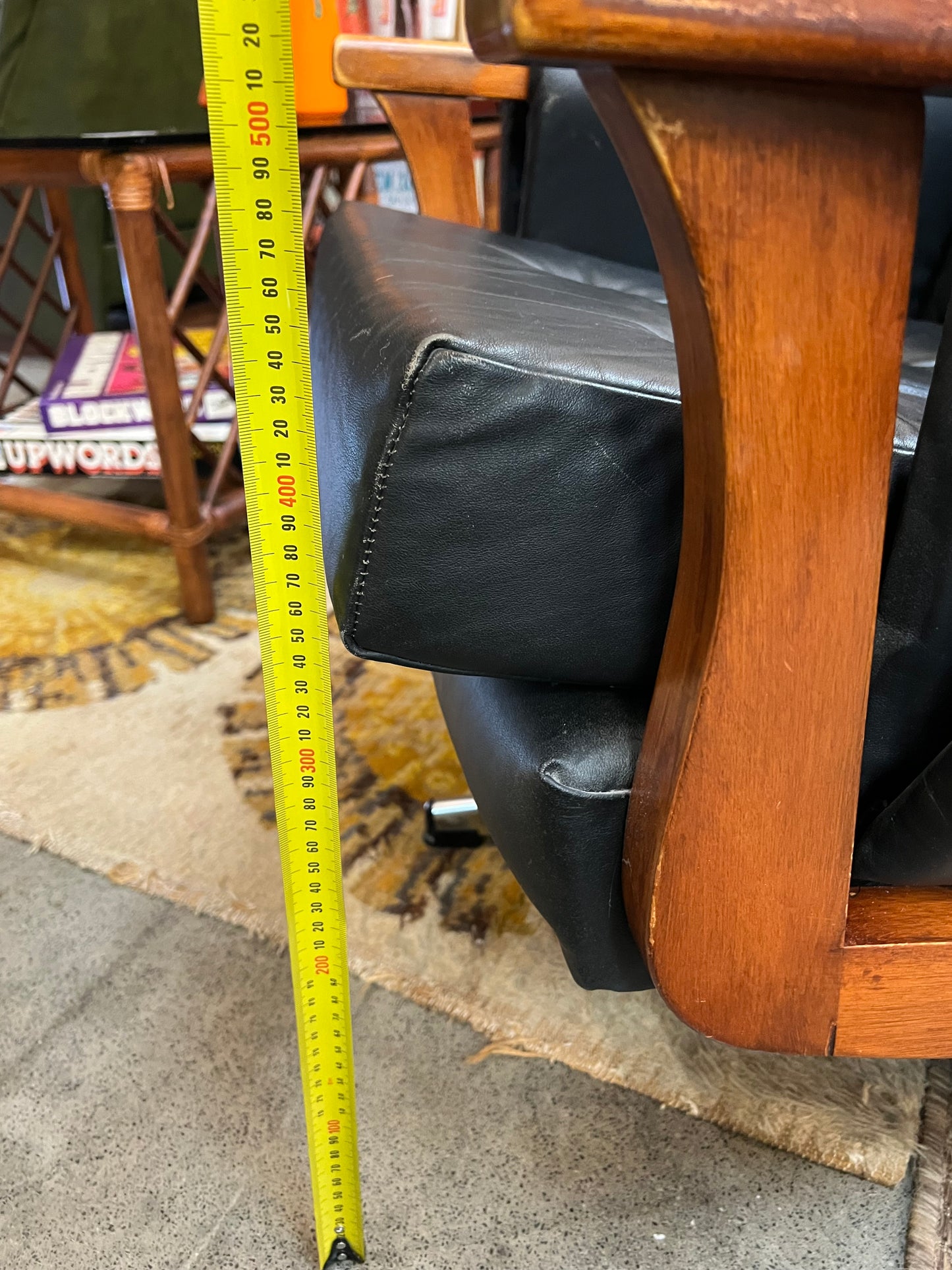 1. Mid-Century Black Leather Swivel Lounge Chair