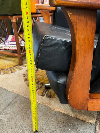 1. Mid-Century Black Leather Swivel Lounge Chair