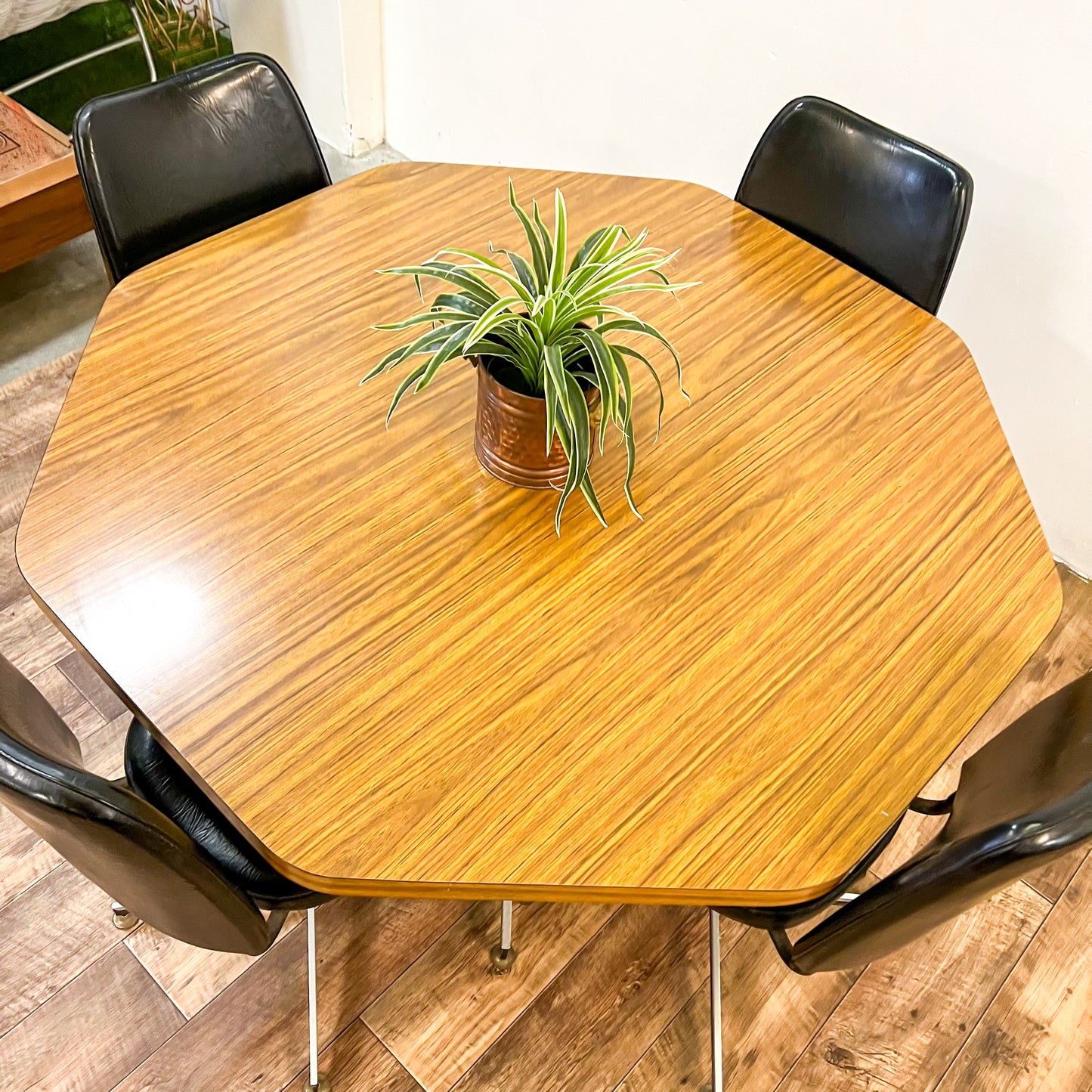 Brown Laminate Octagon Dining Table and 4 Black swivel dining chairs
