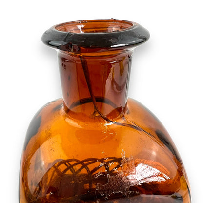 Amber glass decanter bottle with cane base and cork stopper