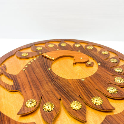 Wooden peacock cutout hanging circle artwork with gold Details.