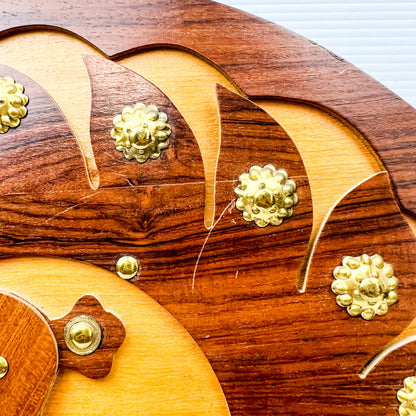 Wooden peacock cutout hanging circle artwork with gold Details.