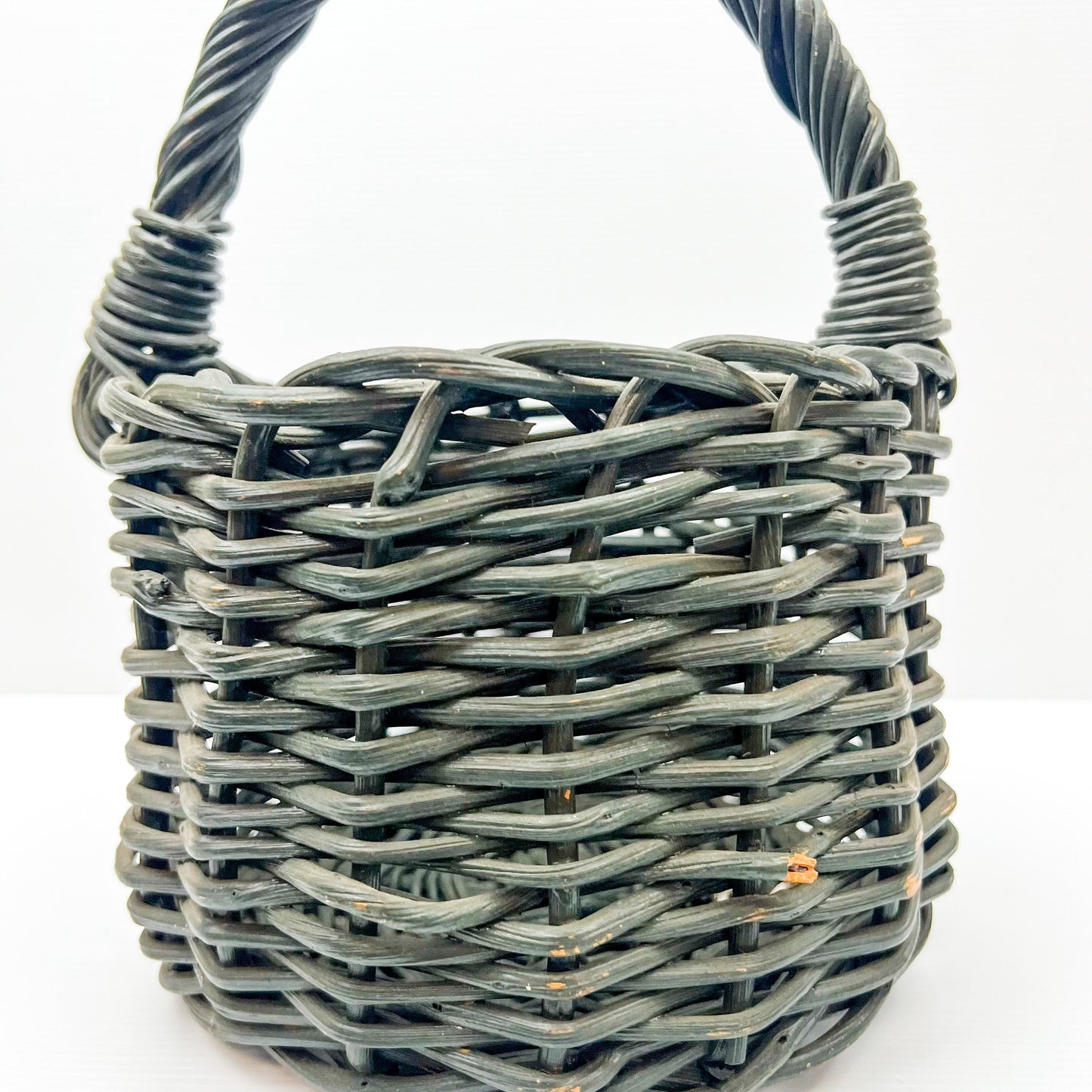 Small Green painted cane basket with handle. Rustic Elegant Decor.