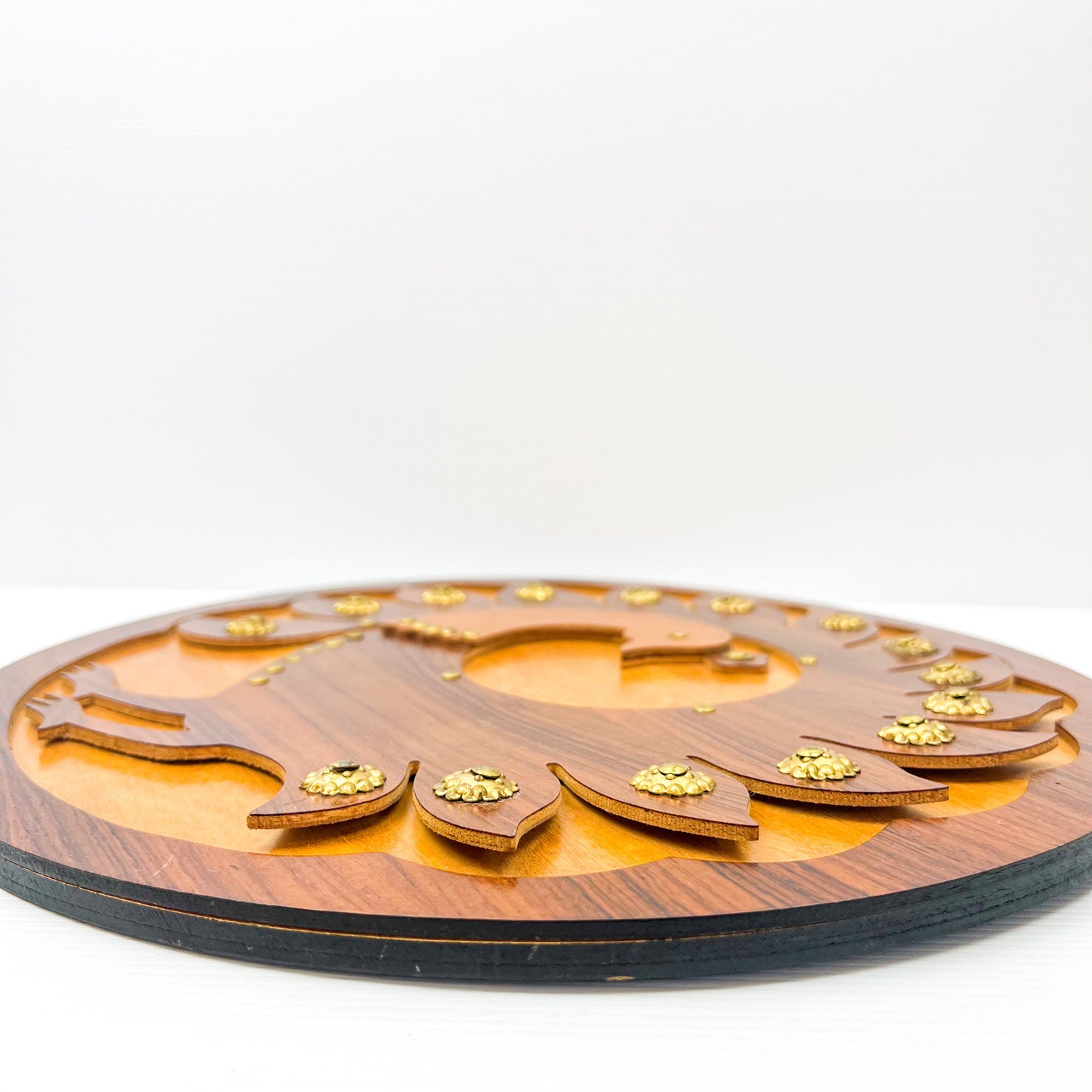Wooden peacock cutout hanging circle artwork with gold Details.