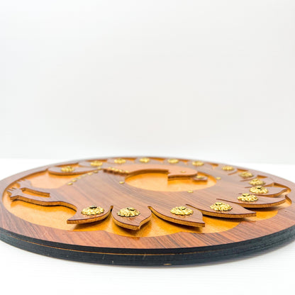 Wooden peacock cutout hanging circle artwork with gold Details.