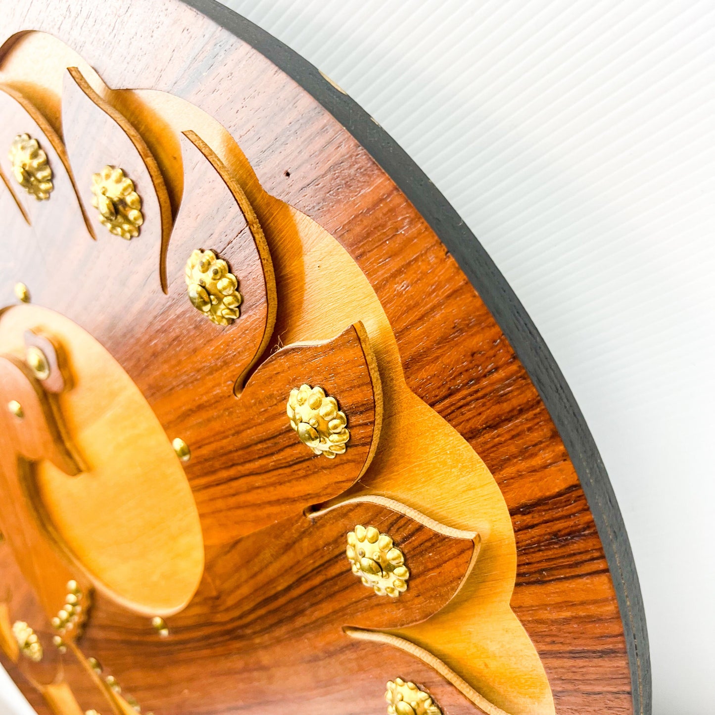 Wooden peacock cutout hanging circle artwork with gold Details.