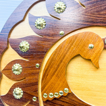 Wooden peacock cutout hanging circle artwork with gold Details.