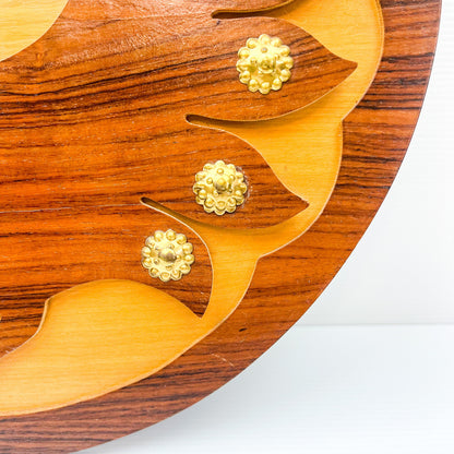 Wooden peacock cutout hanging circle artwork with gold Details.