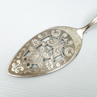 Silver cake serving utensil
