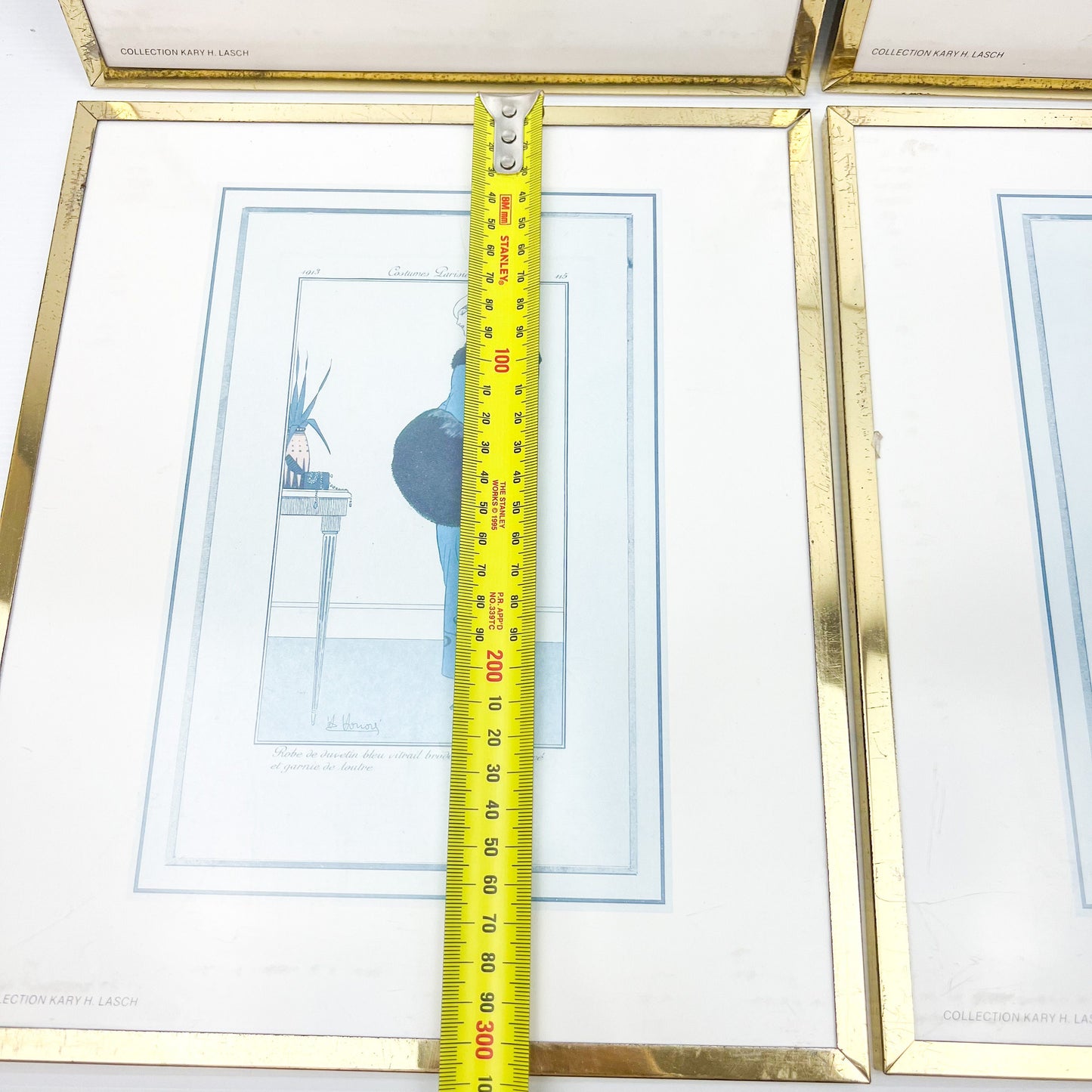 Vintage prints of ladies in elegant clothing brass frames set of 4