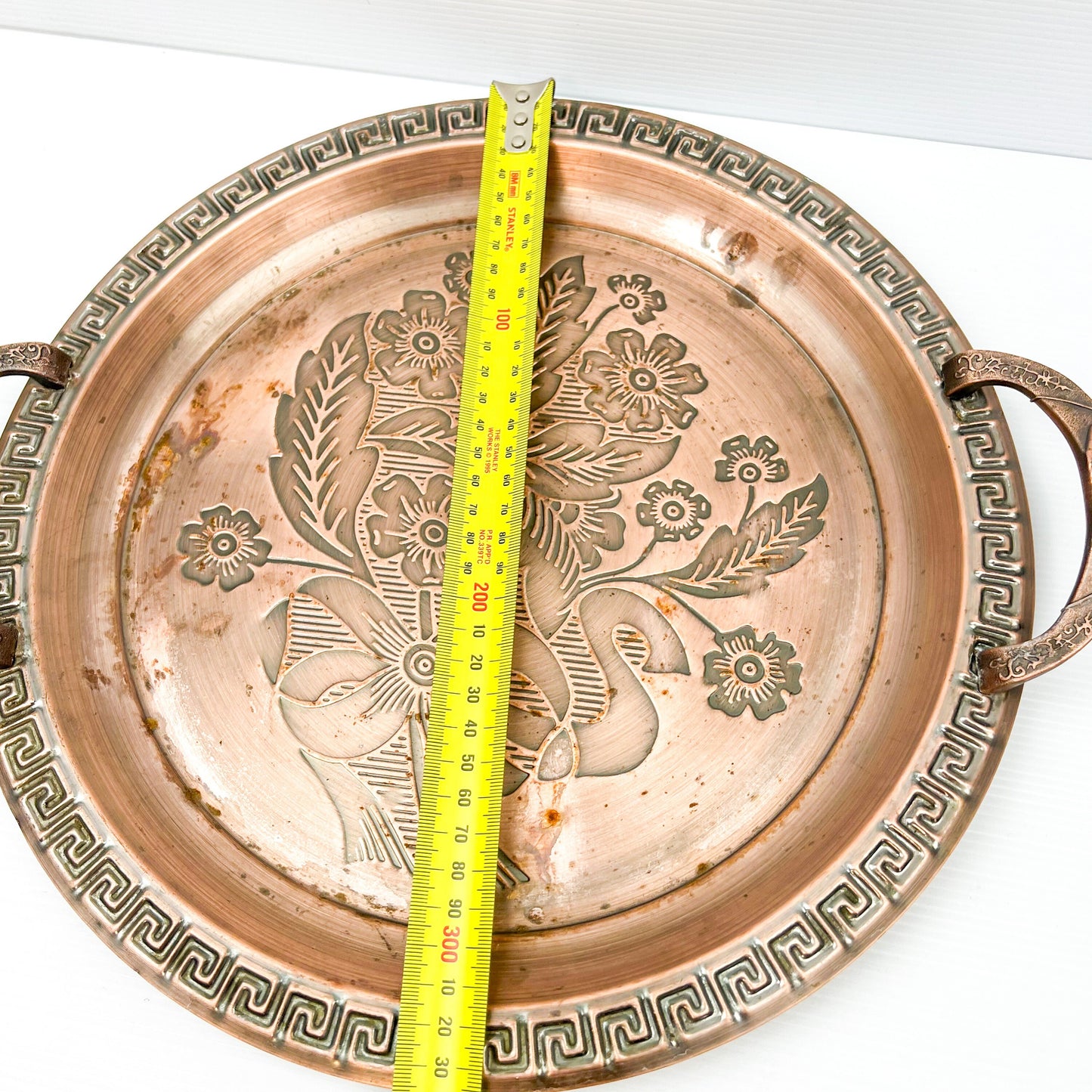 Copper colour metal round drink serving tray with flower artwork design