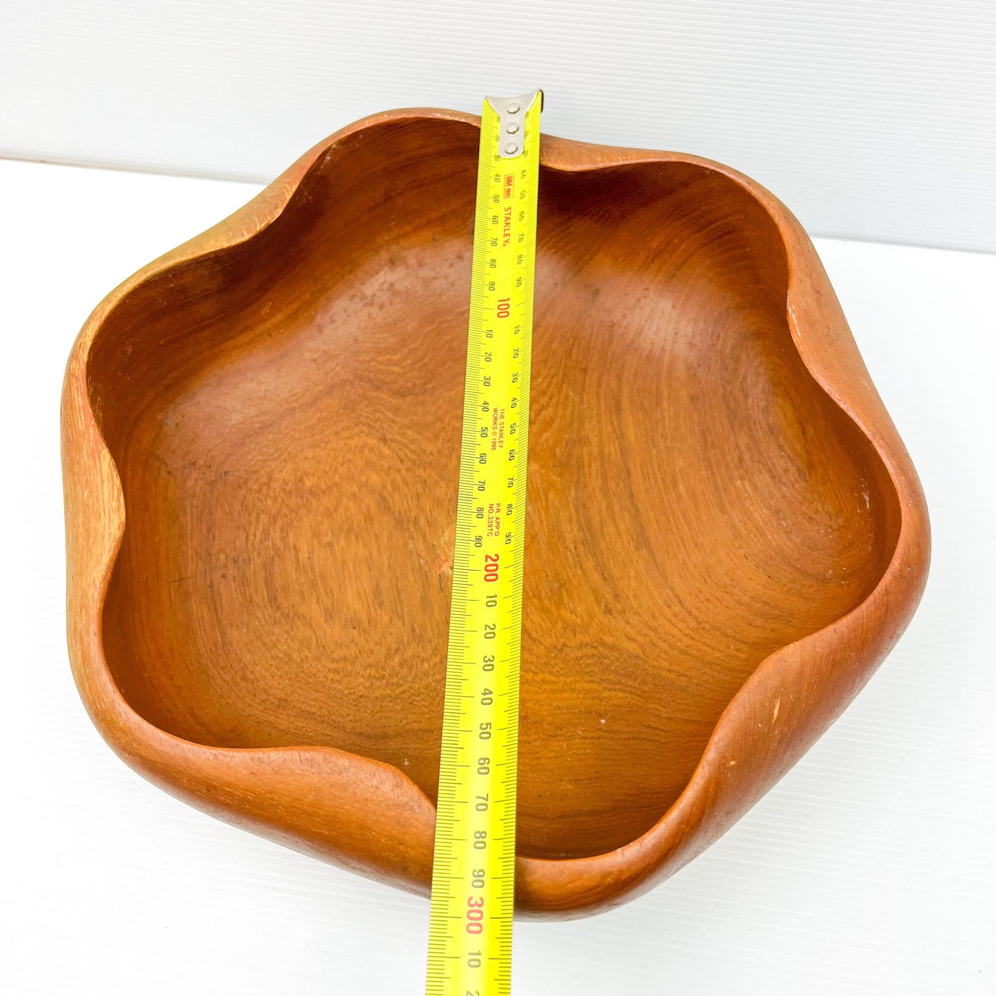 Large wooden serving bowl with ripple Wave edge