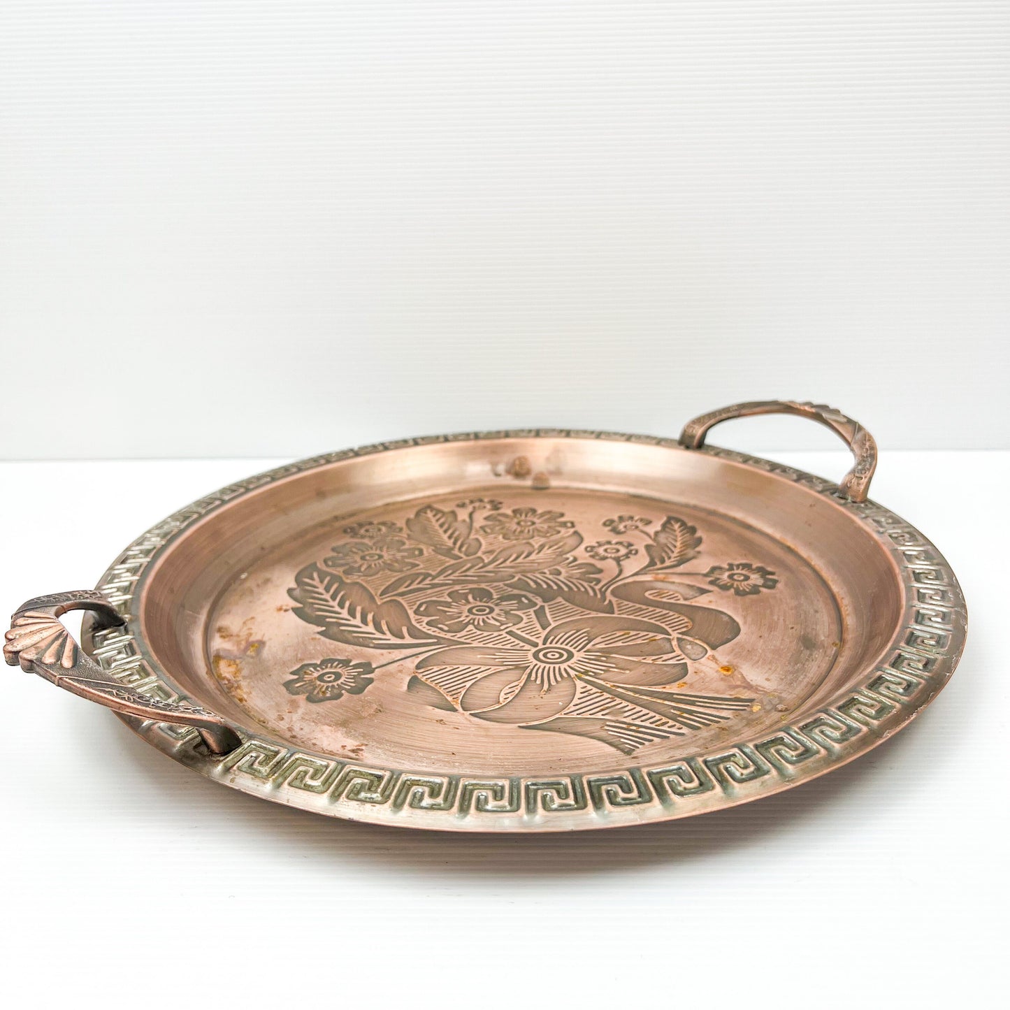 Copper colour metal round drink serving tray with flower artwork design