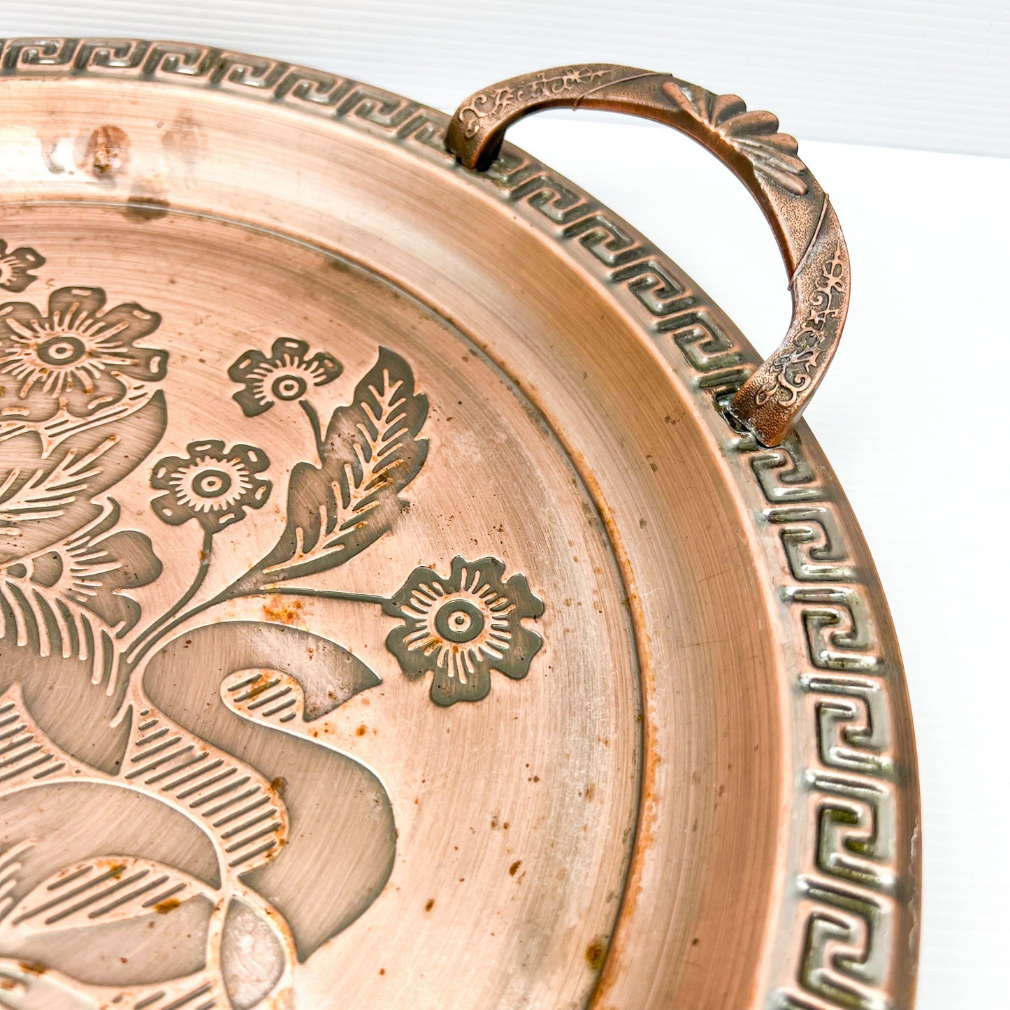 Copper colour metal round drink serving tray with flower artwork design