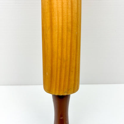 Wooden rolling pin with brown plastic handles