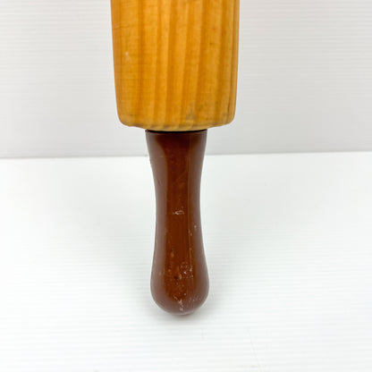 Wooden rolling pin with brown plastic handles