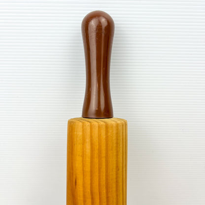 Wooden rolling pin with brown plastic handles