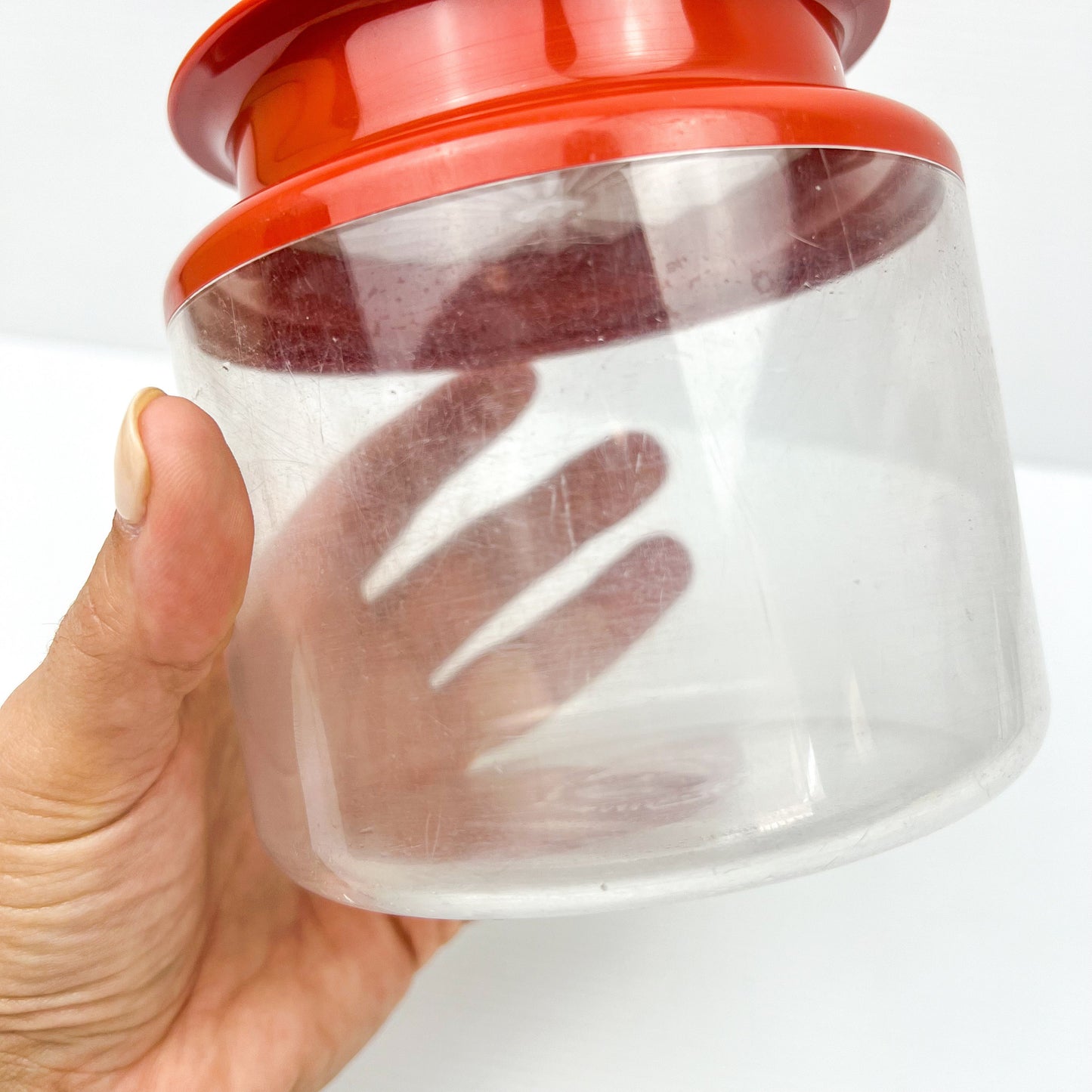 Red and Clear Plastic Tupperware Storage Container