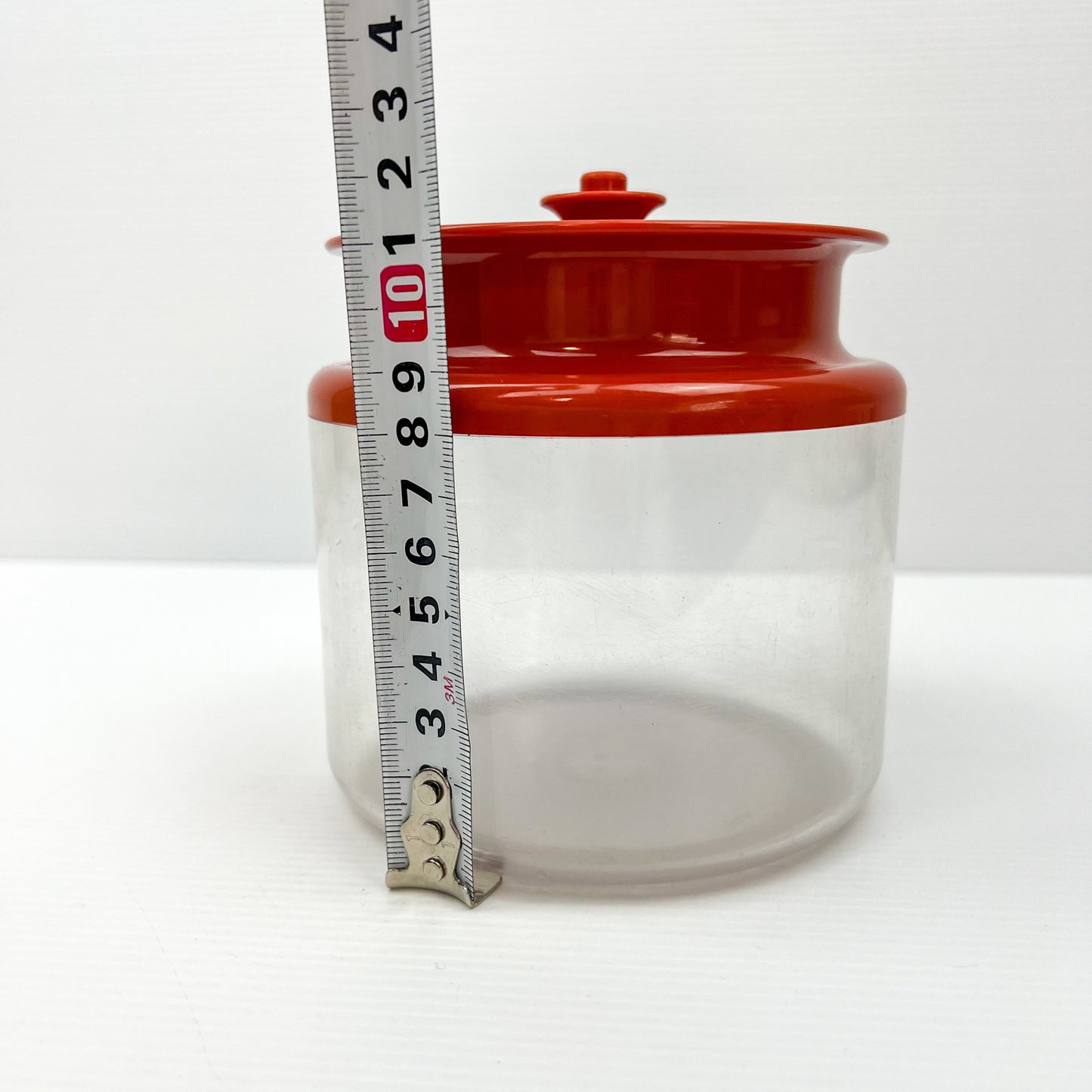 Red and Clear Plastic Tupperware Storage Container