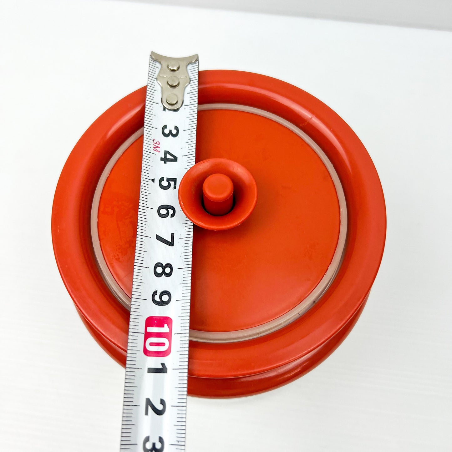 Red and Clear Plastic Tupperware Storage Container